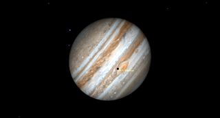 A large Jupiter hangs slanted to the left in black space, its giant red eye near its center, with the small shadow of labeled moon Io on its lid.